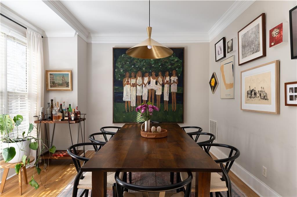 7 Chief Matthews Road, Unit 2B Decatur, GA 30030 - Photo 4 of 41 a view of a dining room with furniture window and wooden floor