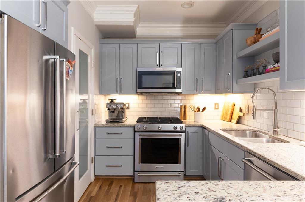 7 Chief Matthews Road, Unit 2B Decatur, GA 30030 - Photo 6 of 41 a kitchen with a refrigerator stove and sink