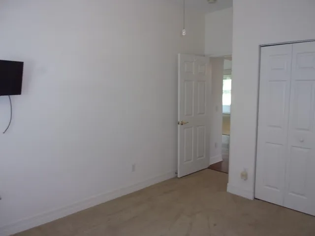 a view of a chandelier in big room and chandelier