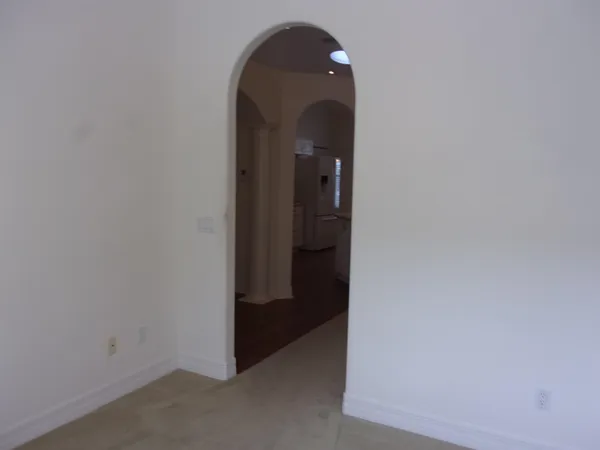 a kitchen with stainless steel appliances a sink a window and cabinets
