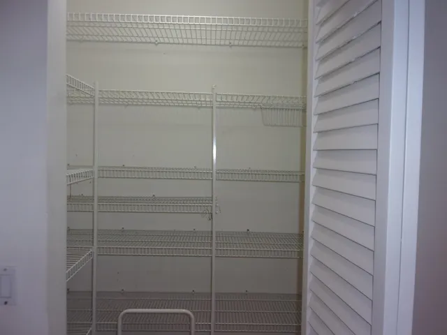 a view of kitchen with stove and microwave