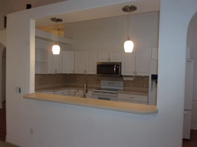 a view of empty room with floor to ceiling window