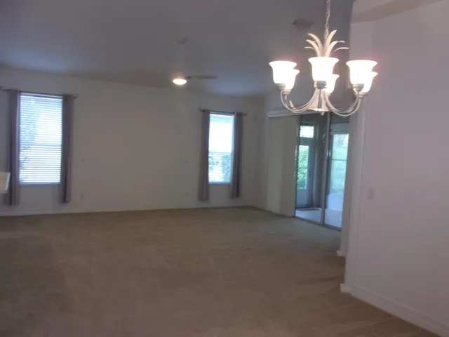 a view of an empty room with a fireplace