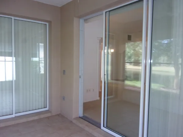 a bathroom with a shower a toilet and a window