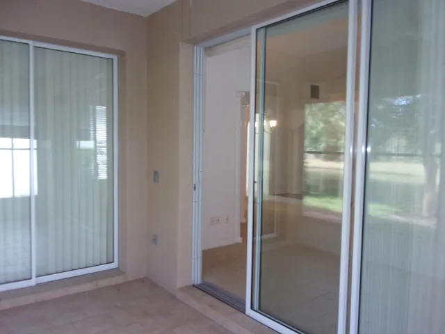 a bathroom with a shower a toilet and a window