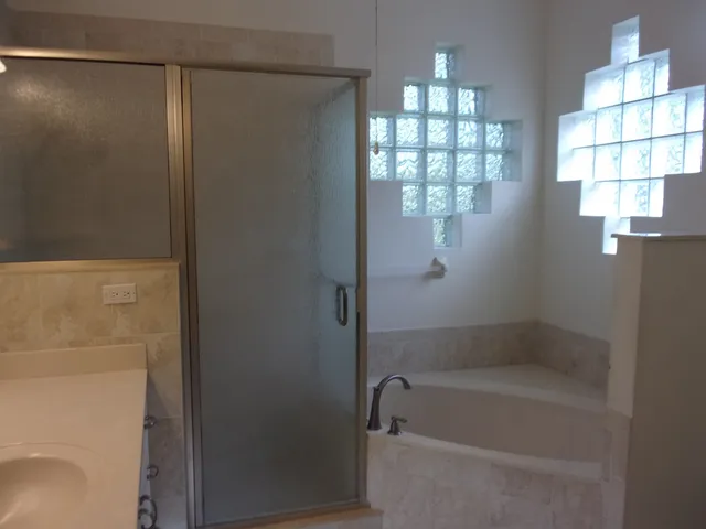 a view of a hallway with washer and dryer