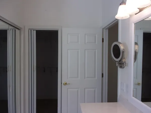 a bathroom with a glass shower door