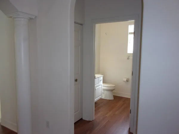 a bathroom with a toilet sink and window