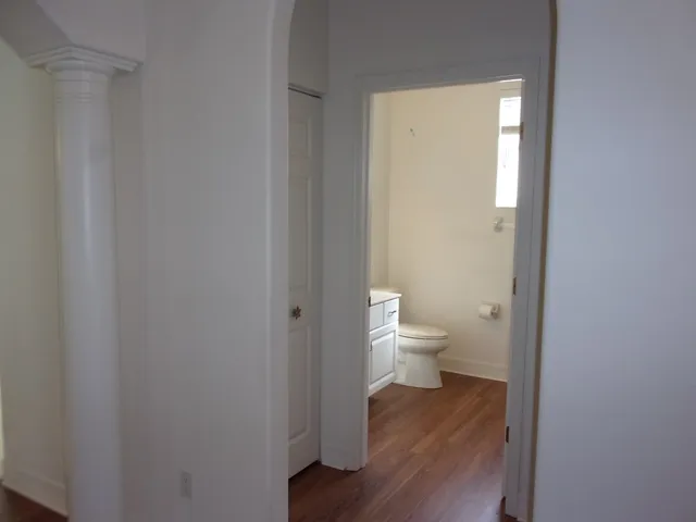 a bathroom with a toilet sink and window