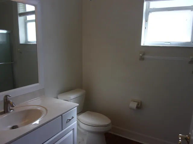 a bathroom with a glass shower door