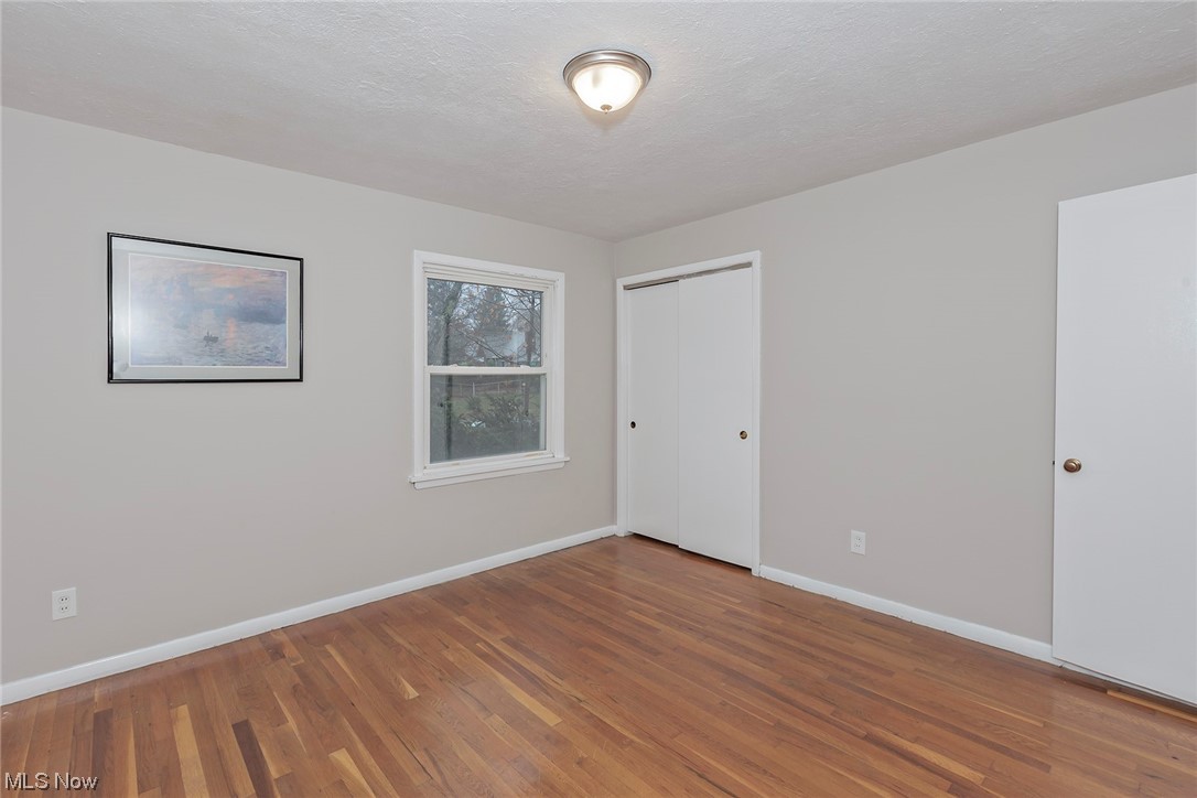 4402 Bayard Road South Euclid, OH 44121 - Photo 16 of 27 1st floor Owners bedroom with hardwood floors