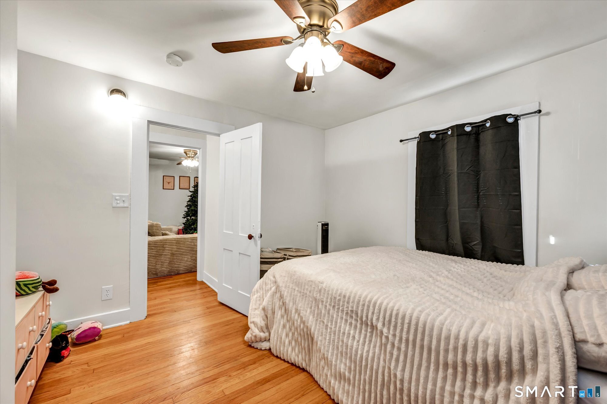 15 Mountain Street Vernon, CT 06066 - Photo 14 of 17 a bedroom with a bed and a chandelier