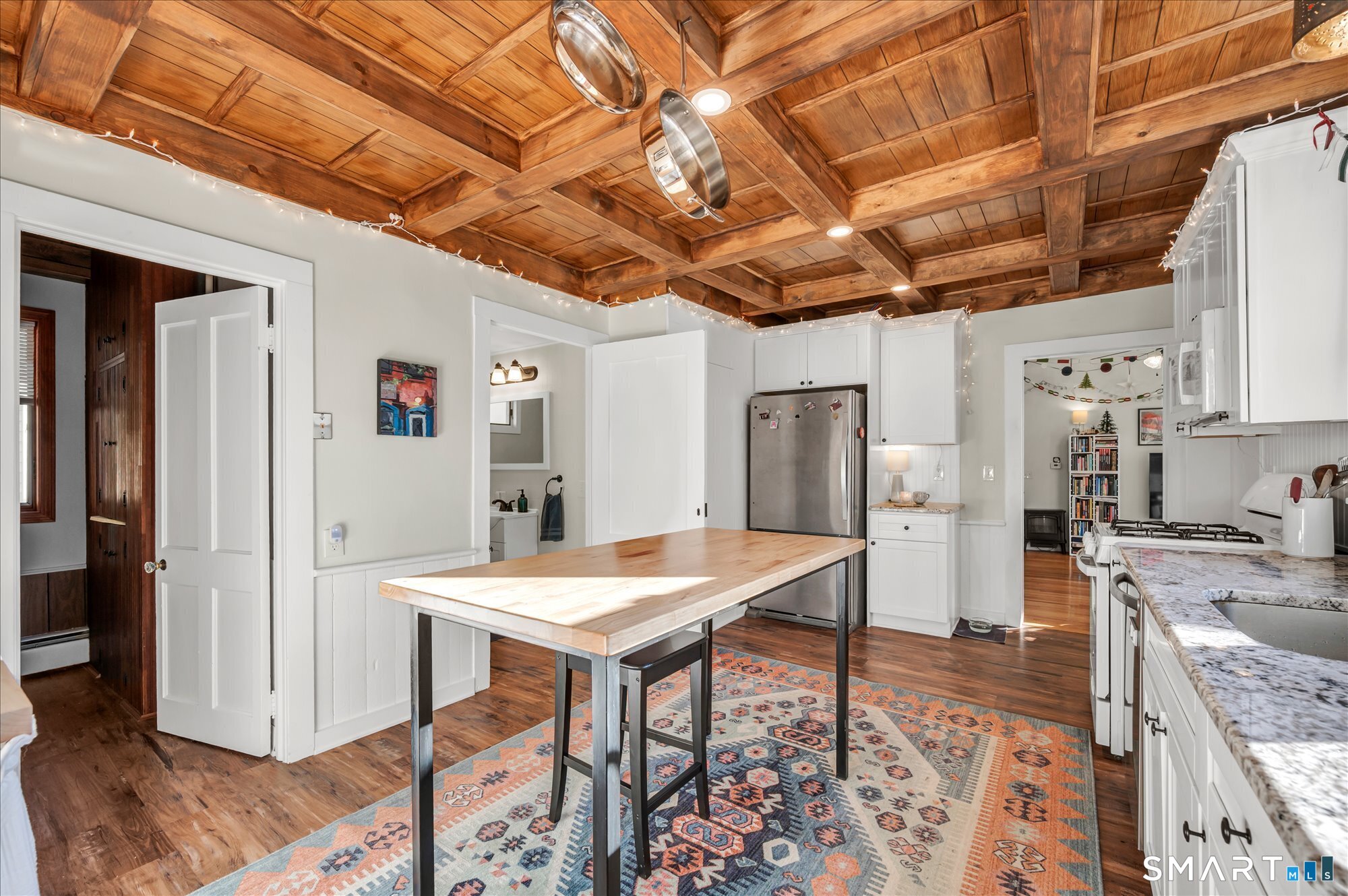 15 Mountain Street Vernon, CT 06066 - Photo 3 of 17 a kitchen with stainless steel appliances granite countertop a sink a stove a refrigerator with white cabinets and wooden floor