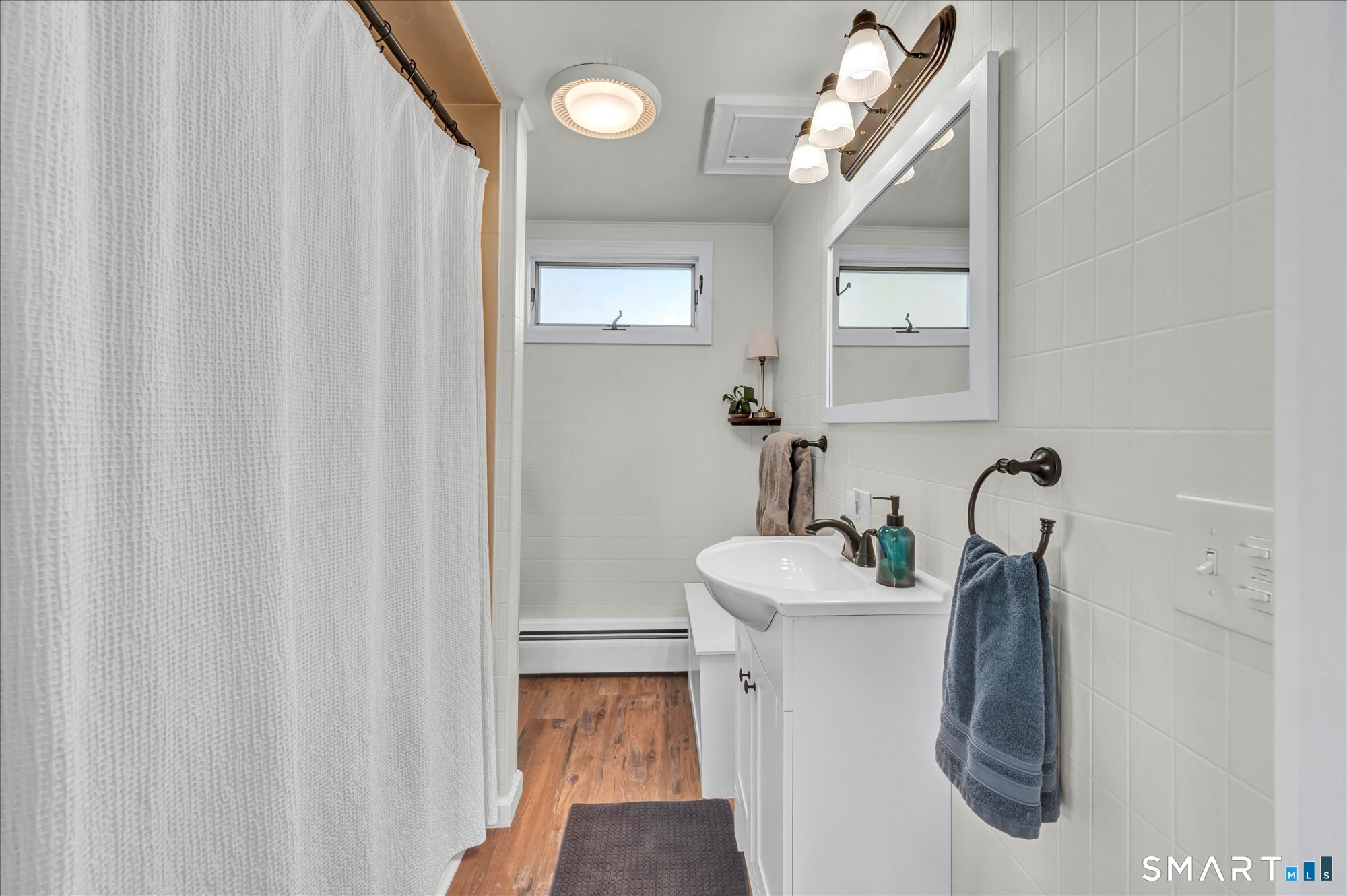 15 Mountain Street Vernon, CT 06066 - Photo 5 of 17 a bathroom with a sink vanity and mirror