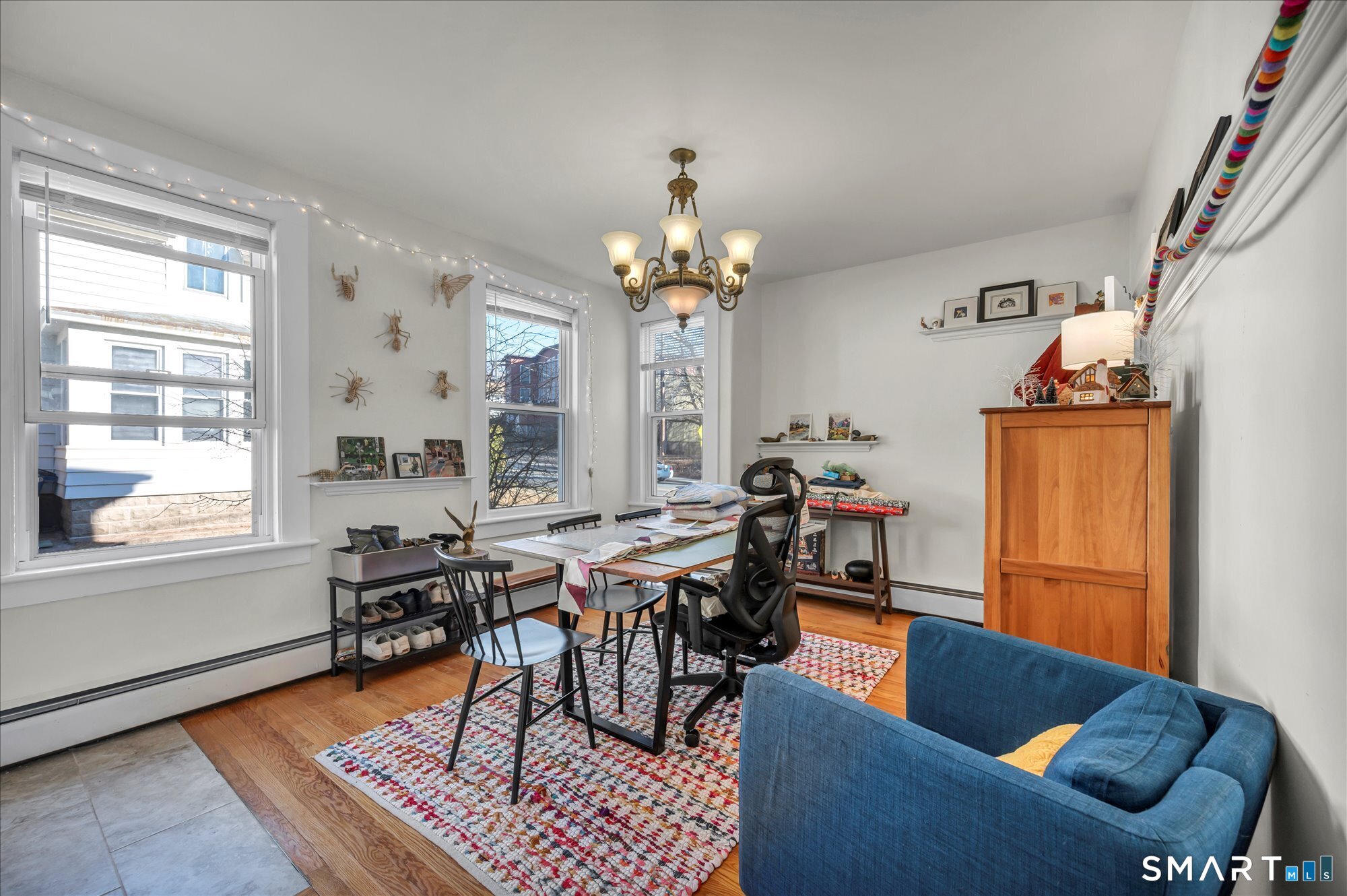 15 Mountain Street Vernon, CT 06066 - Photo 6 of 17 a living room with furniture a dining table and a chandelier