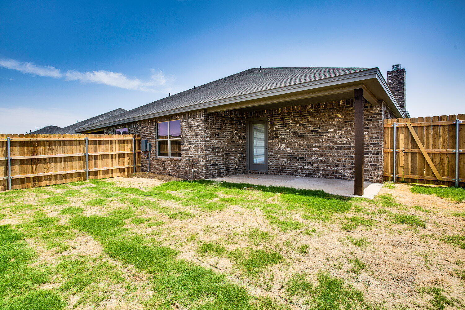 12106 Elkhart Avenue, Unit B Lubbock, TX 79424 - Photo 17 of 17 a front view of a house with garden