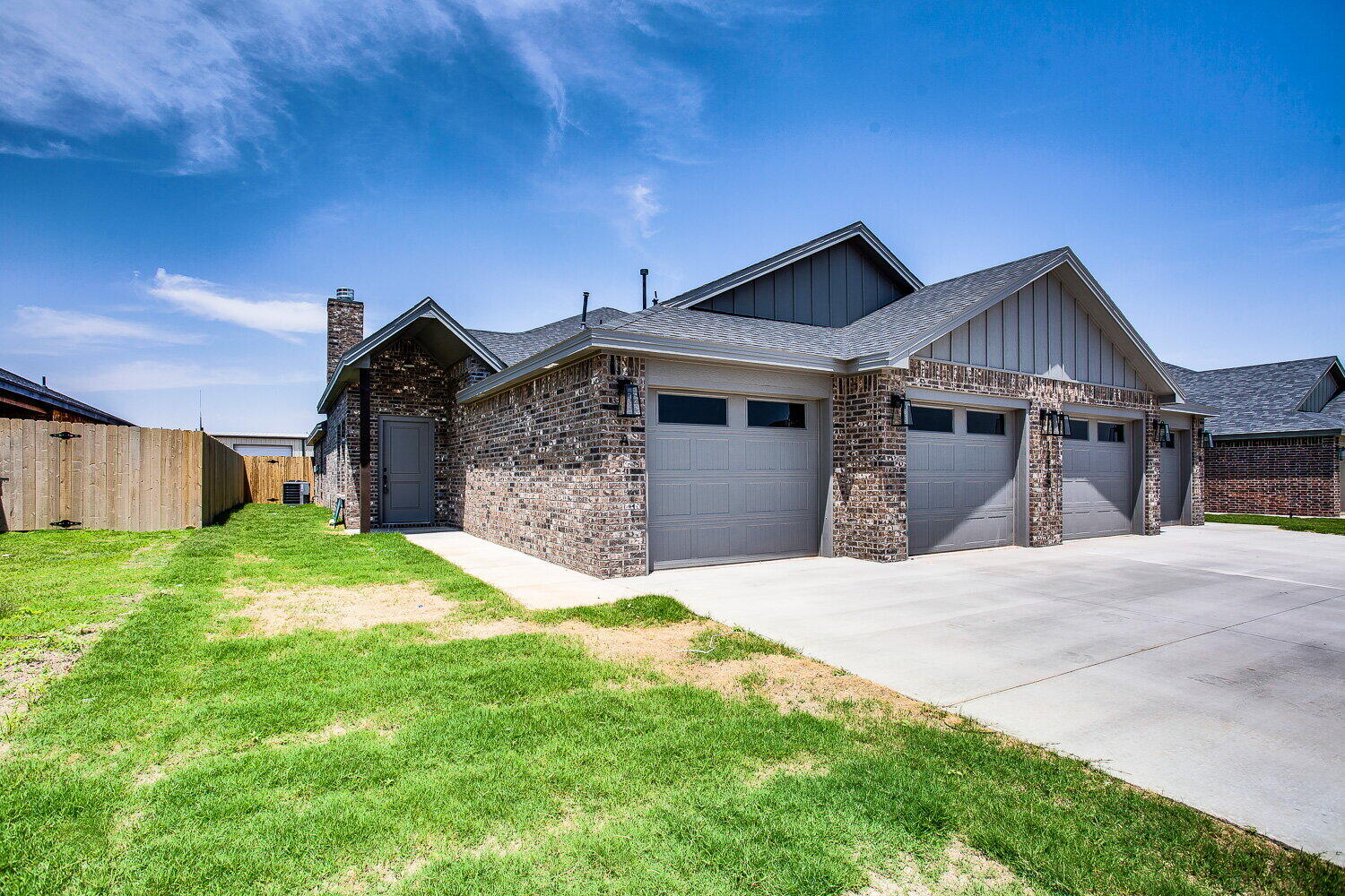12106 Elkhart Avenue, Unit B Lubbock, TX 79424 - Photo 2 of 17 a front view of a house with yard and large tree