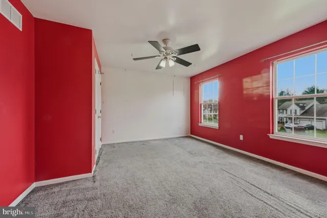 a view of a livingroom with window and furniture
