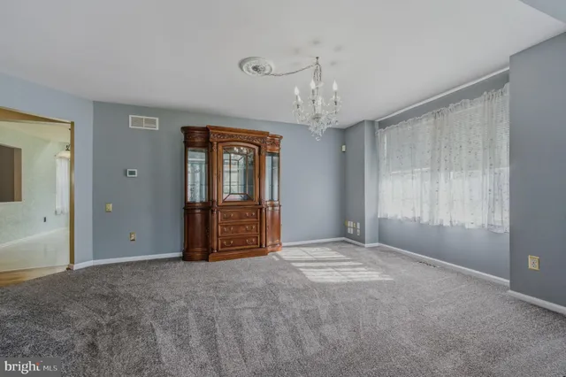 a view of a chandelier and window in a room