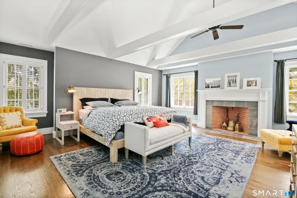 a bedroom with a bed and a couch