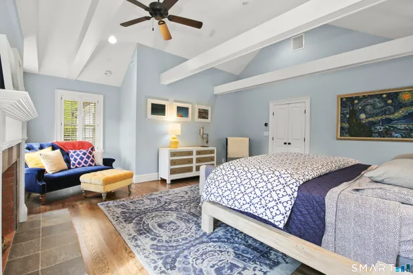 a bedroom with furniture and windows