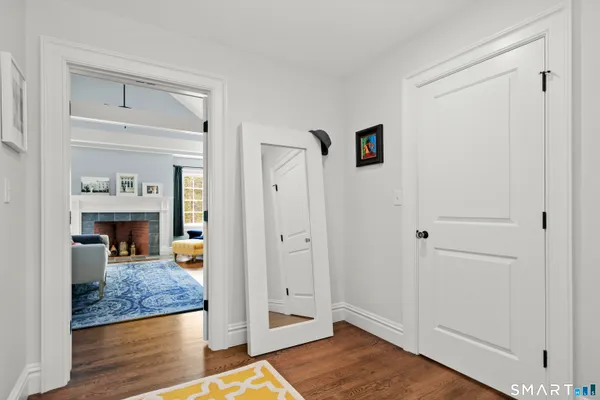 a view of living room with furniture and wooden floor