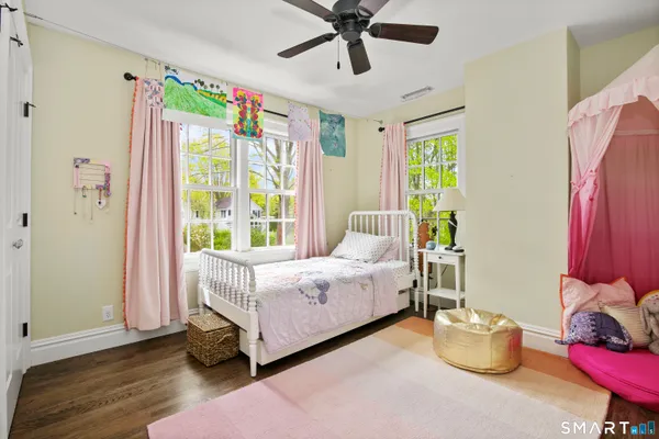 a bed room with a bed and a window