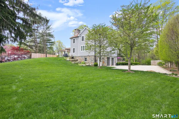 a view of a house with a big yard