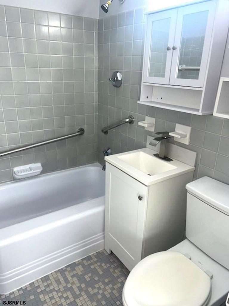 101 South Raleigh Avenue, Unit 320 Atlantic City, NJ 08401 - Photo 18 of 28 a bathroom with a sink a toilet and shower
