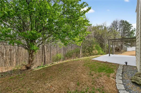 a backyard of a house with lots of green space
