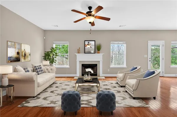 a living room with furniture fireplace and window