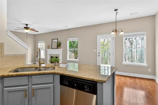 a kitchen with a sink and window