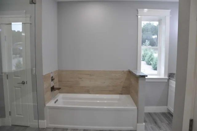 a bathroom with a shower and a sink