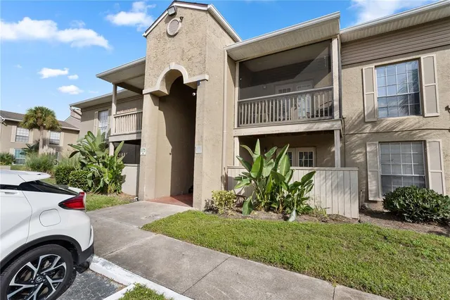 a view of a backyard with a tree