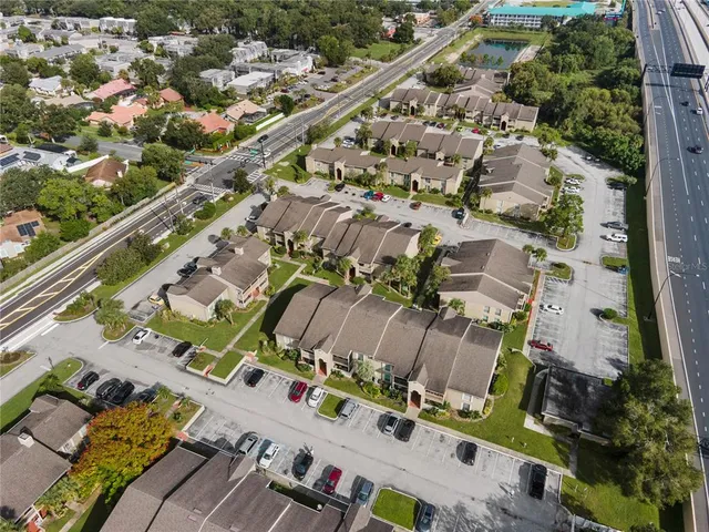 an aerial view of residential houses with outdoor space