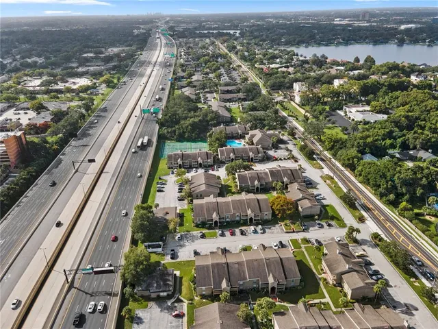 an aerial view of houses with outdoor space