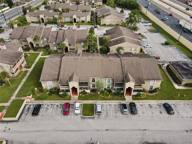 an aerial view of a city with lawn chairs