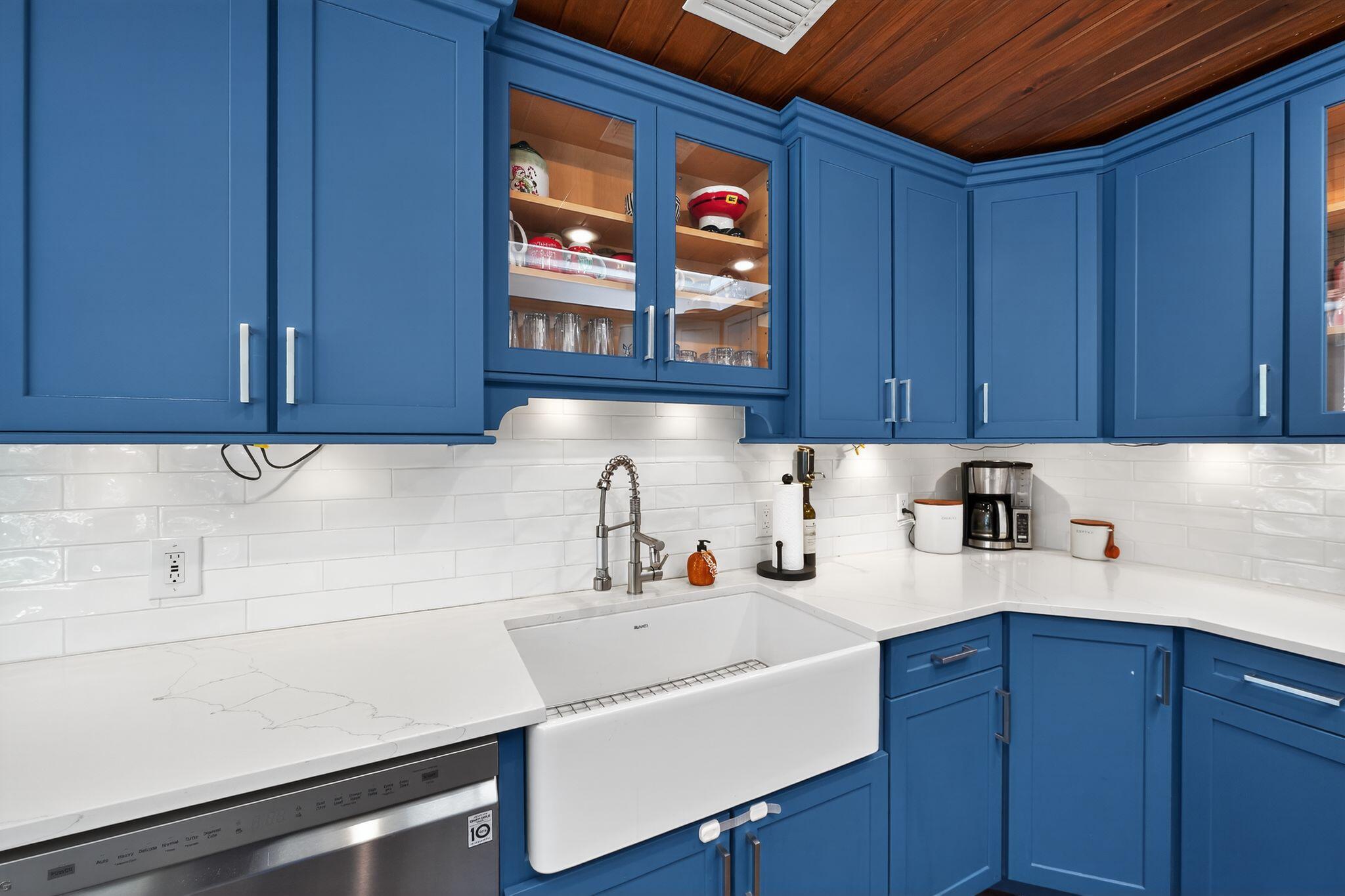 556 Meadow Wood Way Stuart, FL 34997 - Photo 11 of 57 a kitchen with a sink cabinets and window