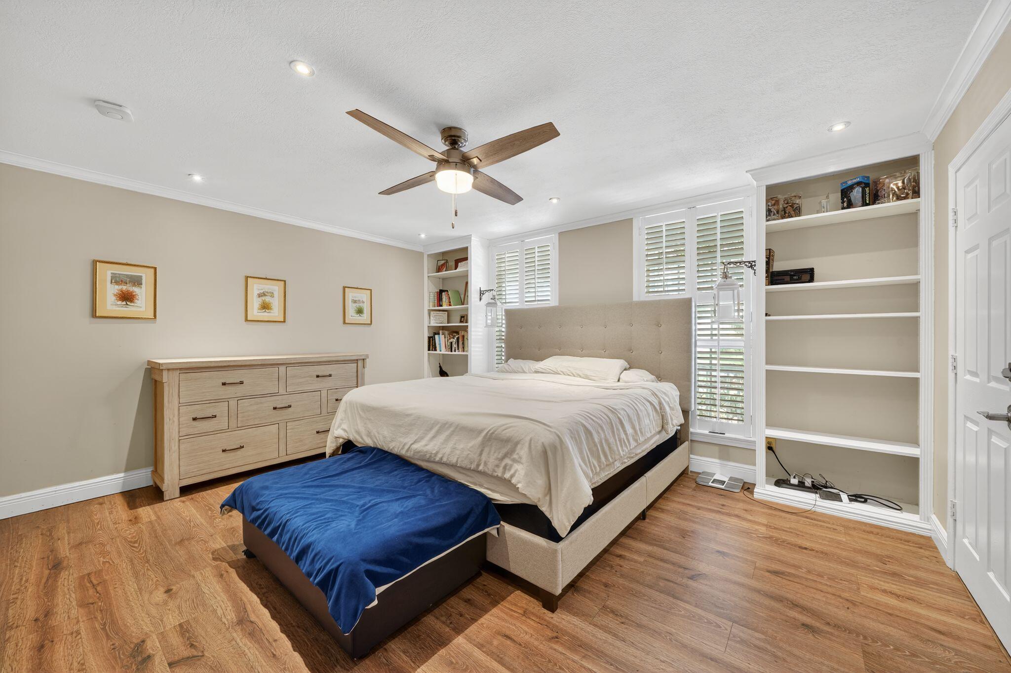 556 Meadow Wood Way Stuart, FL 34997 - Photo 18 of 57 a bedroom with a bed and a window