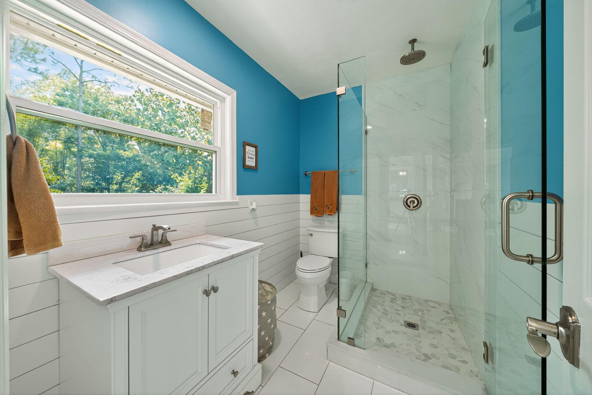 556 Meadow Wood Way Stuart, FL 34997 - Photo 19 of 57 a bathroom with a sink toilet and shower