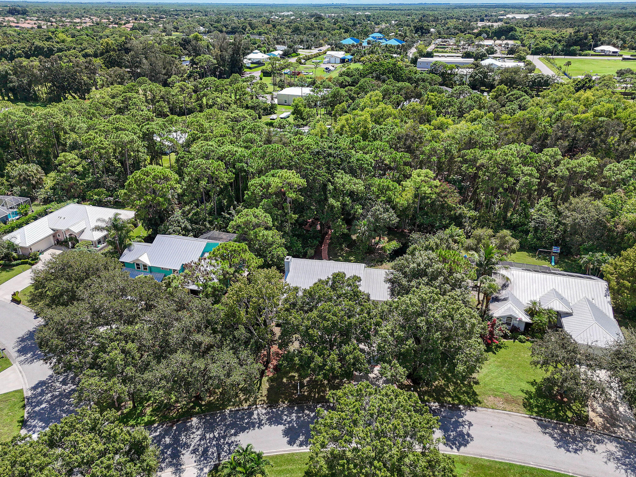 556 Meadow Wood Way Stuart, FL 34997 - Photo 34 of 57 an aerial view of a house with a yard