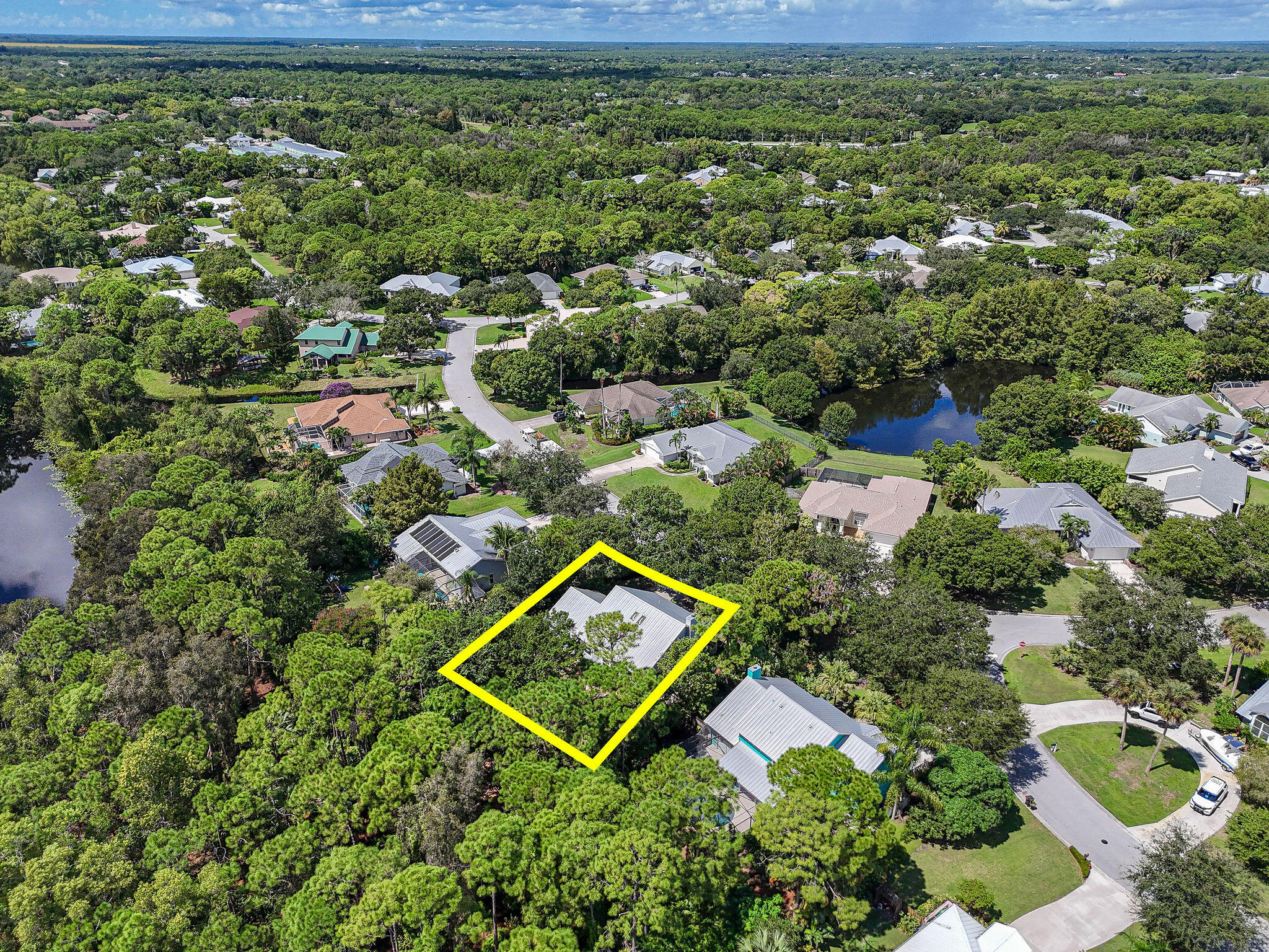 556 Meadow Wood Way Stuart, FL 34997 - Photo 45 of 57 an aerial view of a house with a yard