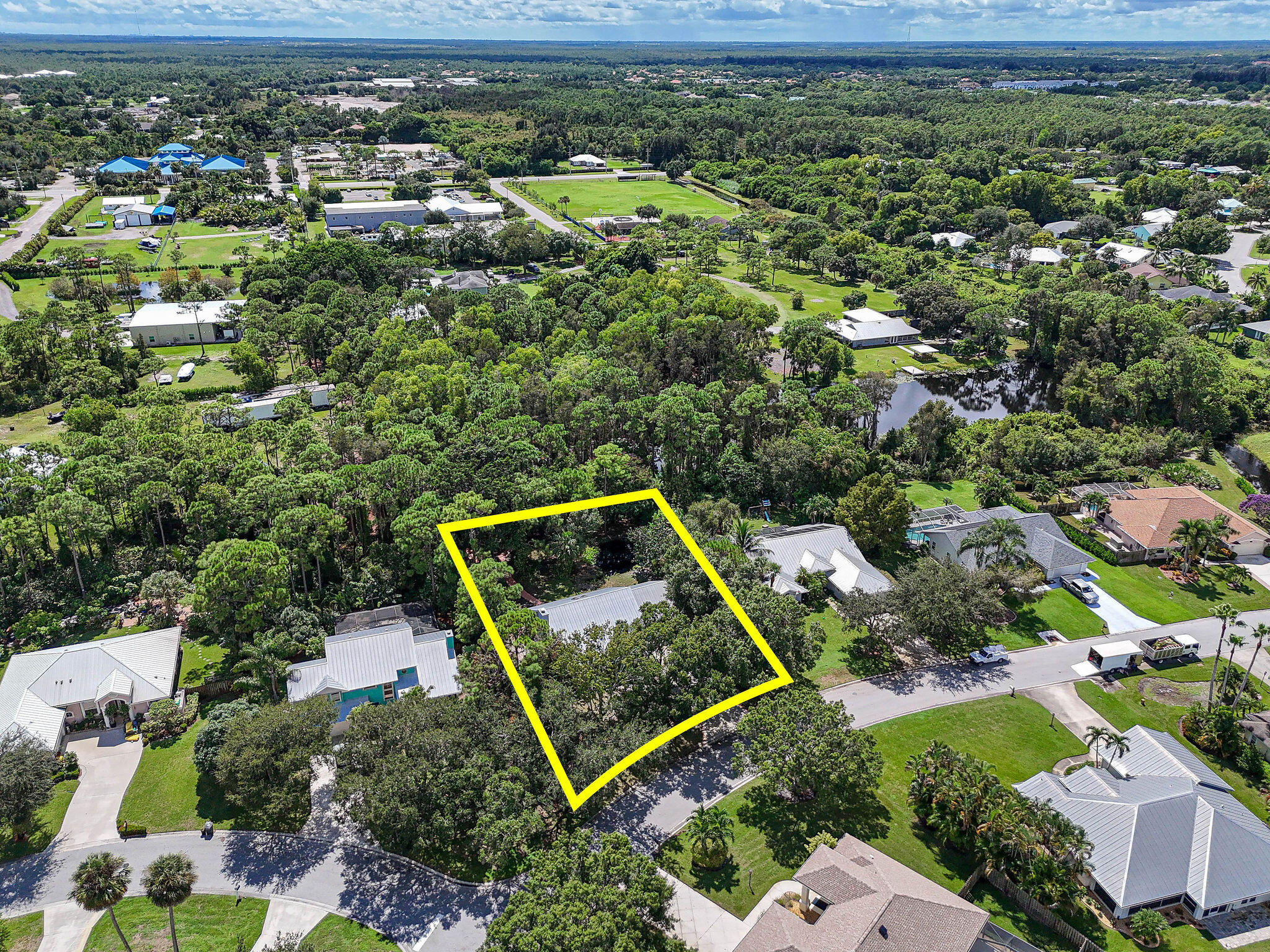 556 Meadow Wood Way Stuart, FL 34997 - Photo 49 of 57 an aerial view of a house with a yard