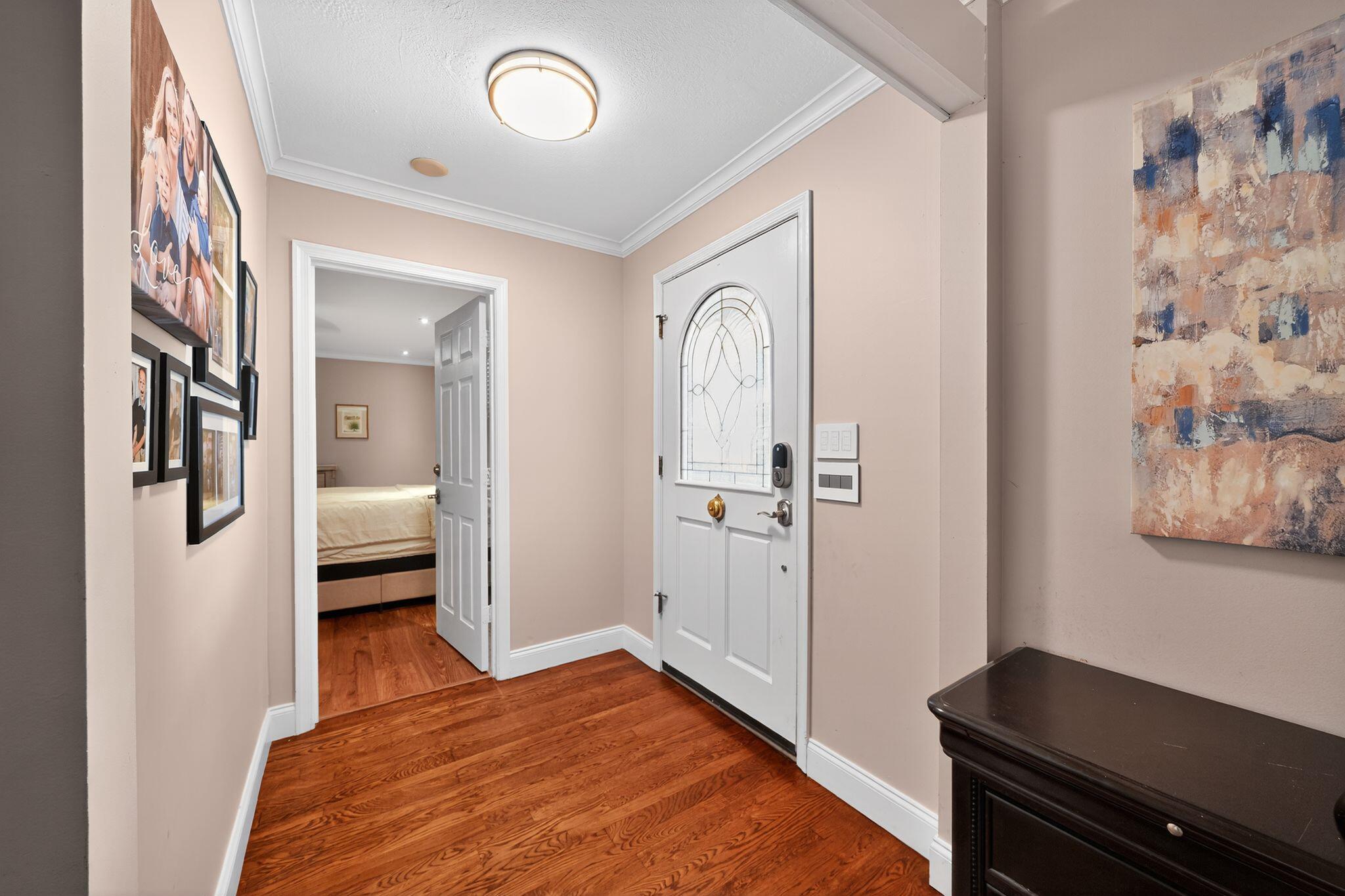 556 Meadow Wood Way Stuart, FL 34997 - Photo 5 of 57 a bedroom with a bed and wooden floor