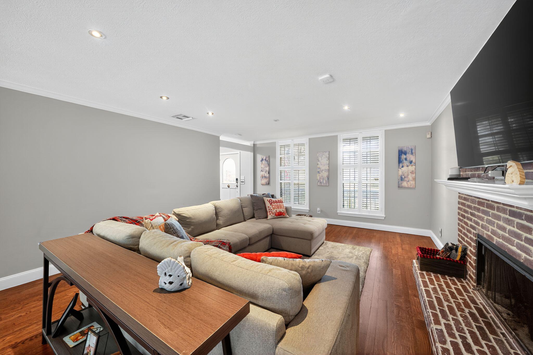 556 Meadow Wood Way Stuart, FL 34997 - Photo 8 of 57 a living room with furniture and a couch