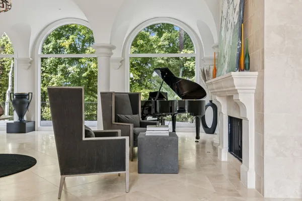 a dining hall with stainless steel appliances lots of furniture and wooden floor