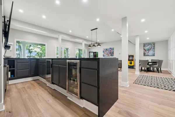 a living room with furniture a rug and a large window