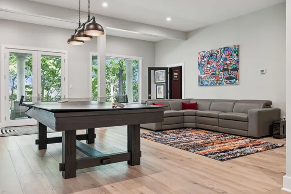 a view of a livingroom with furniture and a workspace