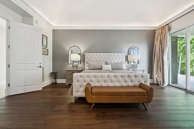 a bathroom with a tub a sink and mirror