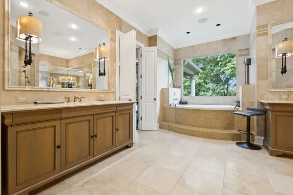 a bedroom with a bed couch and a window